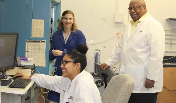 Warner and students in lab.