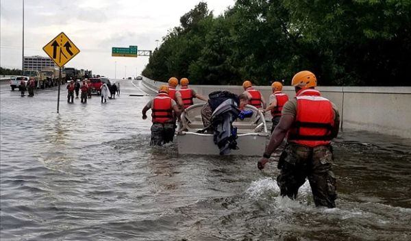 First responders performing rescues during floods from Hurricane Harvey's rains