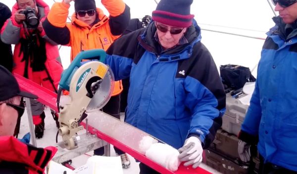 scientist Lonnie Thompson cuts an ice core