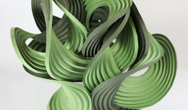Photo of curve-crease sculpture called Green Balance, created by Erik and Martin Demaine.