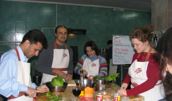 Students at the Petra workshop prepare a traditional Jordanian dinner.