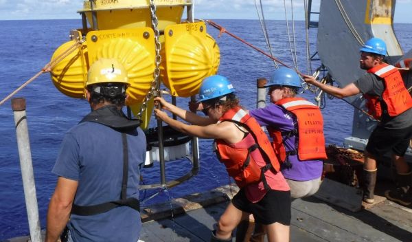 scientists and crew of the R/V Atlantic Explorer recover a deep ocean sediment trap