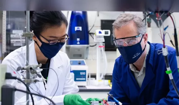 researchers examine their newly-designed sea water electrolyzer