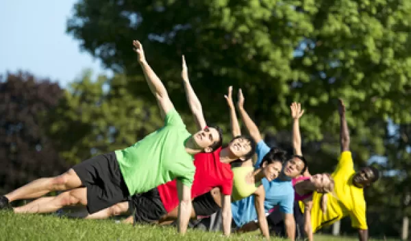 group of people exercising outdoors