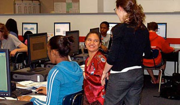 Photo of Julia Barnathan assisting a student with a lesson
