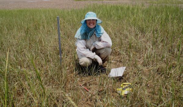 Photo of Virginia Schutte collecting data in the field.