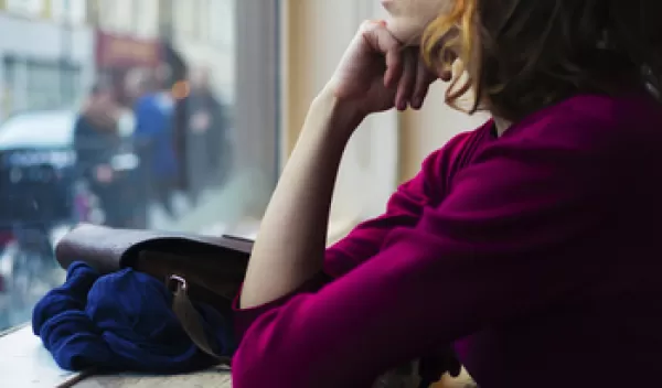 woman looking out of the window