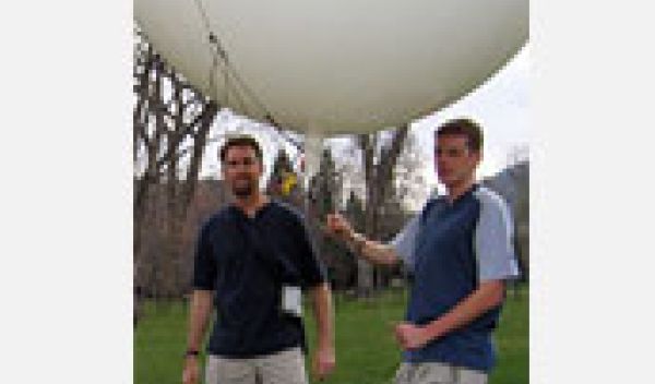 Scientists prepare to launch a balloon to test an emergency deflation system designed for the blimp.