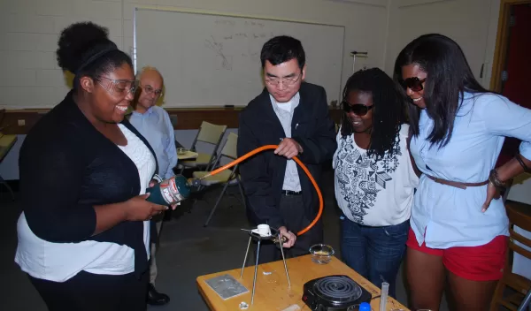 student and professor in a glass lab