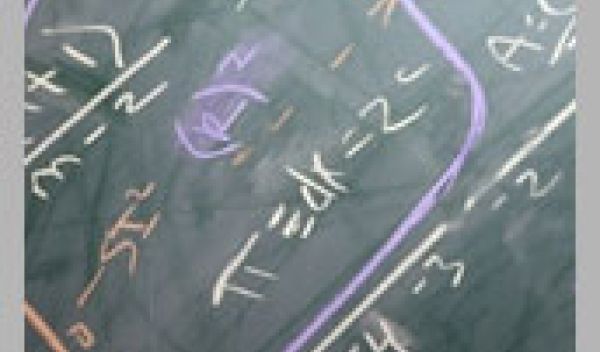 Mathematical equations on chalkboard.