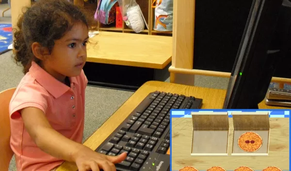 Photo of a preschooler matching pizzas by the number of toppings.
