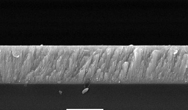 Cross-sectional view of a cadmium telluride thin film on glass via a scanning electron microscope.