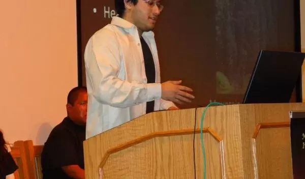 Photo of Raphael Perea delivering a presentation.