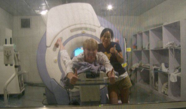 Photo of Sook-Lei Liew and R.J. Andrews in the MR scanner room at Peking University First Hospital.
