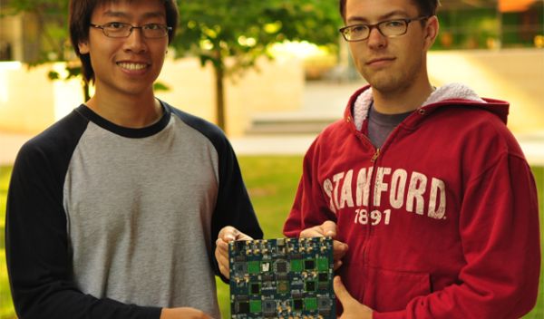 Graduate students Sam Fok and Alex Neckar hold a brain-inspired computational platform