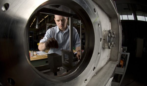 Photo of Ben Arend installing a detector during the reconfiguration of the NSCL's experimental area.