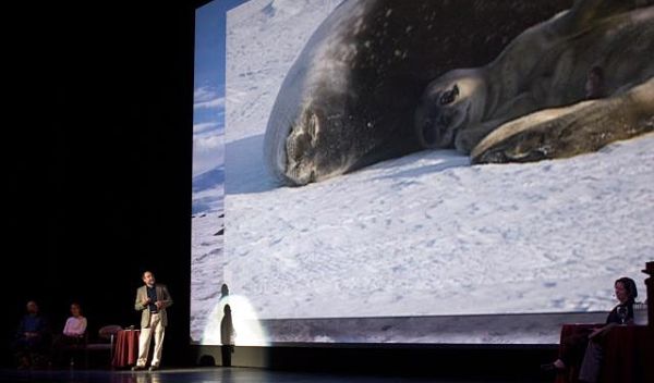 Photo of Randy Davis discussing his research on Weddell seals.