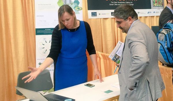 Dominique Davison andvistior at the Global City Team Challenge Expo.