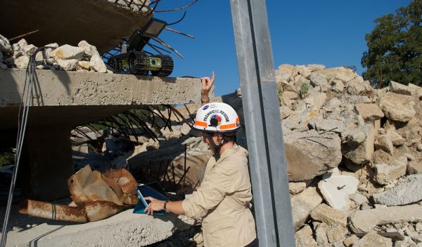 Photo of researcher Robin Murphy studying robot-human interactions during a disaster scenario.