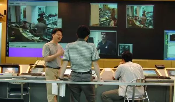 Developers at the NCHC Access Grid node test the SARS Grid network links.