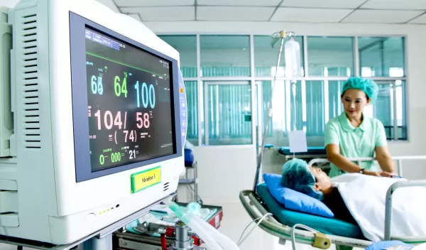 nurse and patient in hospital room