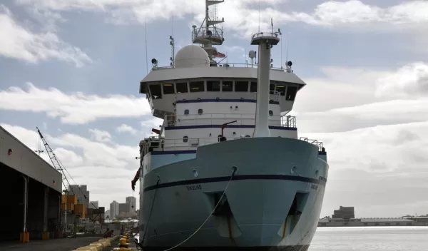 R/V Sikuliaq fueling up in a port before its research cruise in the western Pacific.