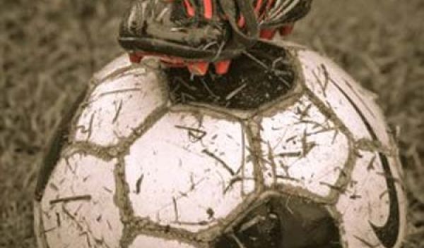 Photo of a soccer player's foot on the ball.