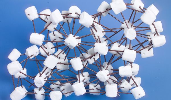 Photo showing marshmallows representing hairy spheres connected with plastic coffee stirrers.