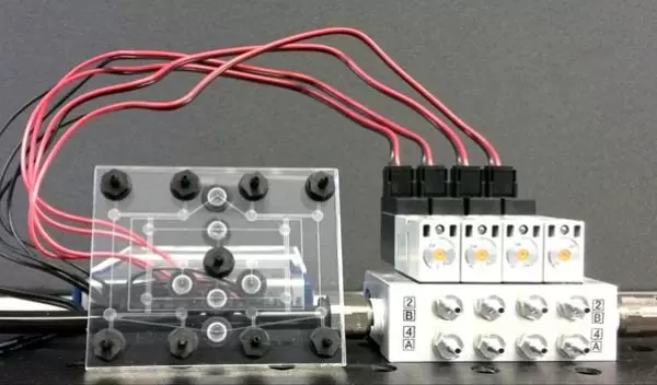 An 8-bit pneumatic RAM chip used to help a soft robot control its movements.