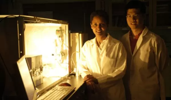 Photo of Sossina Haile and William Chueh next to the benchtop thermochemical reactor.