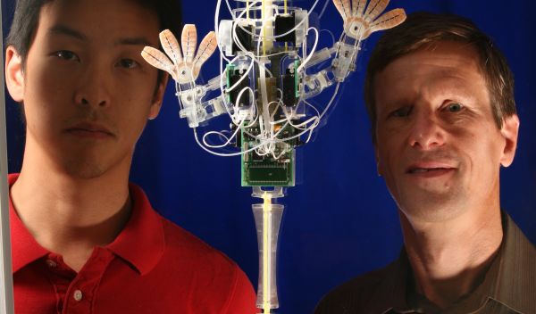 Photo of Sangbae Kim and Mark Cutkosky with the robot stickybot.