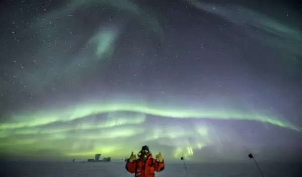 Robert Schwarz gives a thumbs up at the South Pole