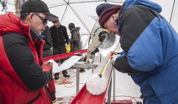 Scientists study an ice core from the Guliya ice cap; the ice held ancient viruses