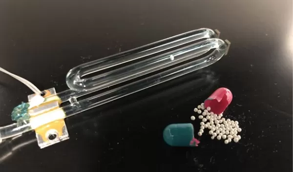 a piece of glass tubing bent like a tuning fork