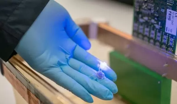 The paddle-shaped device consists of a harvester containing microchips for wireless communication.