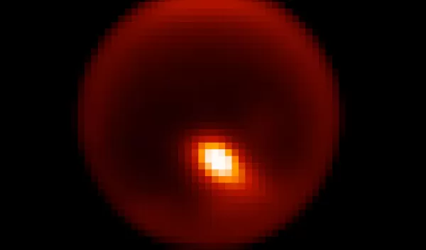 Adaptive optics image of Titan showing storm feature.