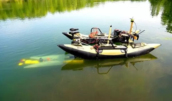 a yellow underwater robot (left)