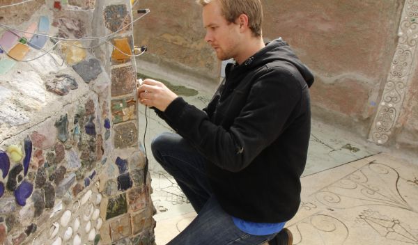 Graduate Student Jackson English installing crack displacement sensors on the Watts Towers