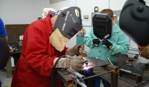 Two students learning welding skills at Weld-Ed.