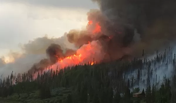 Smoke billows from the Beaver Creek Fire west of Walden, Colorado
