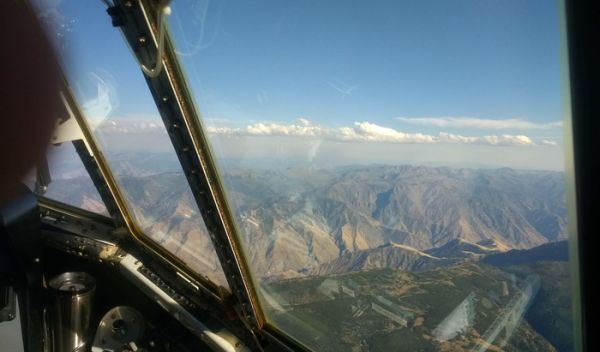 Cumulus clouds caps dense smoke from the Kiawah-Rabbit Foot fires in eastern Idaho.