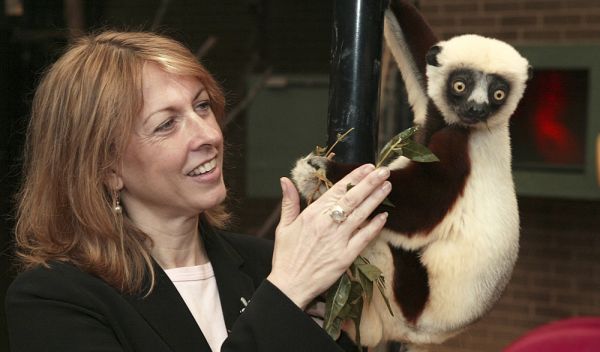 Photo of Duke University Lemur Center director Anne D. Yoder with a Coquerel's Sifaka.