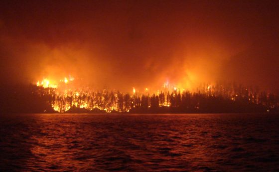 a wildfire as seen across Loon Lake, British Columbia