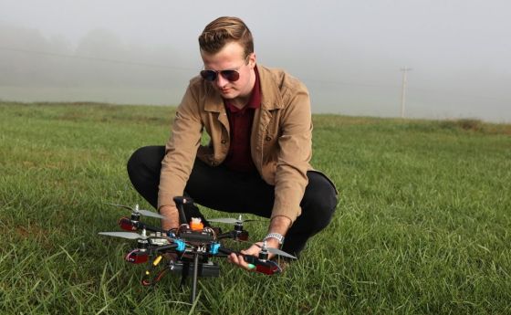 Garrett Asper prepares a multi-rotor drone for a series of test flights