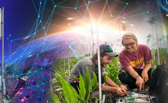 Decorative announcement header with two individuals working on circuitry with a molecule border