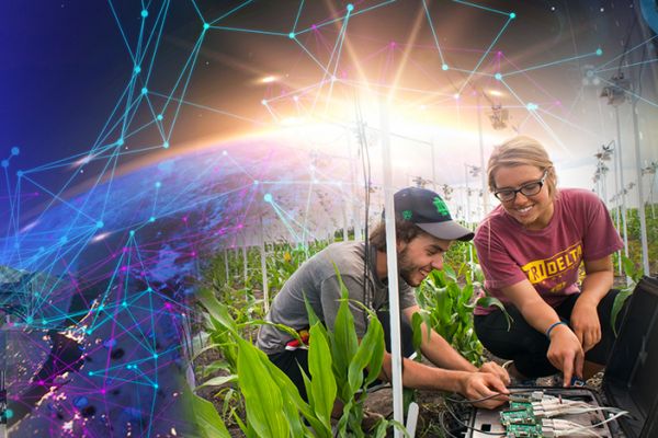 Decorative announcement header with two individuals working on circuitry with a molecule border